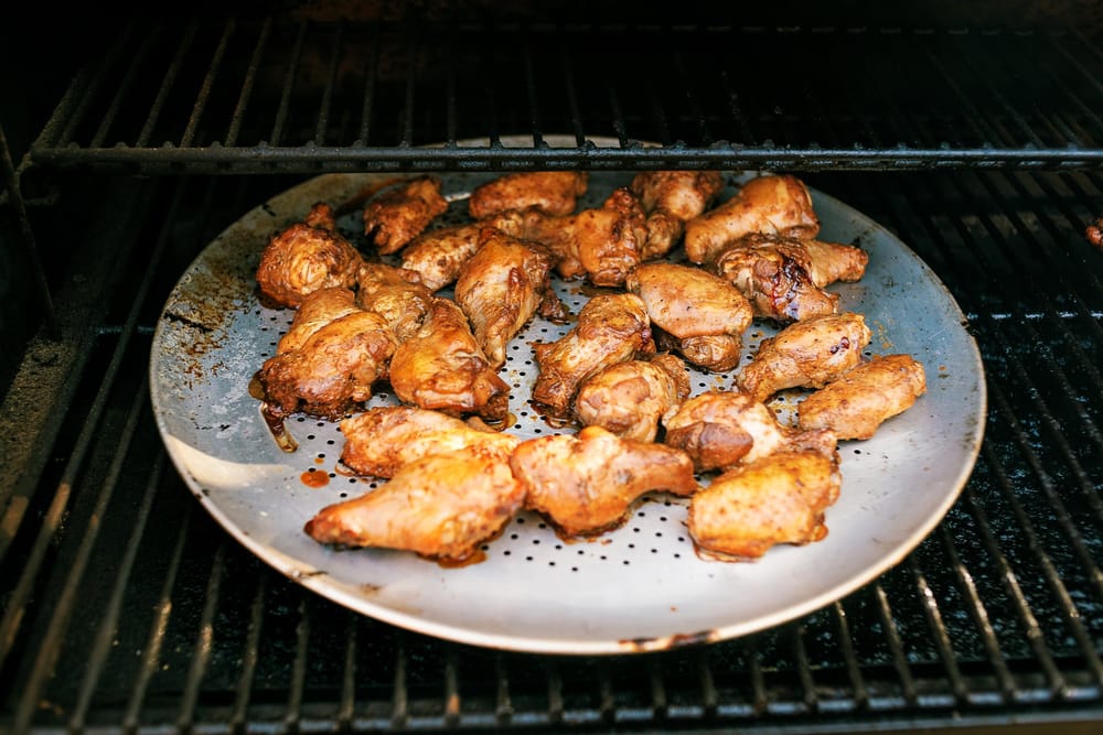 Smoked Peruvian Chicken Wings drizzled with a Aji Verde style spicy green sauce. Umami flavors, paired with a bright zesty and spicy flavors!