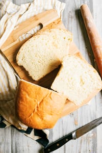 This easy to follow homemade white bread recipe guide will get you on the road to reducing food costs, while getting better quality bread put on the table. This is the best homemade white bread. It's light and fluffy, with a beautiful buttery flavor to it.