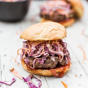 Bacon Bleu Cheese Cole Slaw Burger - A red cabage coleslaw topped on a half pound juicy burger. Amazing way to change up your burger night! dadwithapan.com