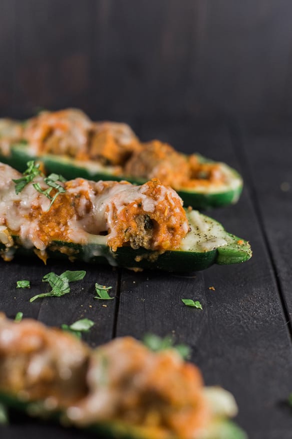 Zucchini boats topped with a quick and simple marinara made from fresh tomatoes, mozzarella, and Personal Trainer Food Meatballs