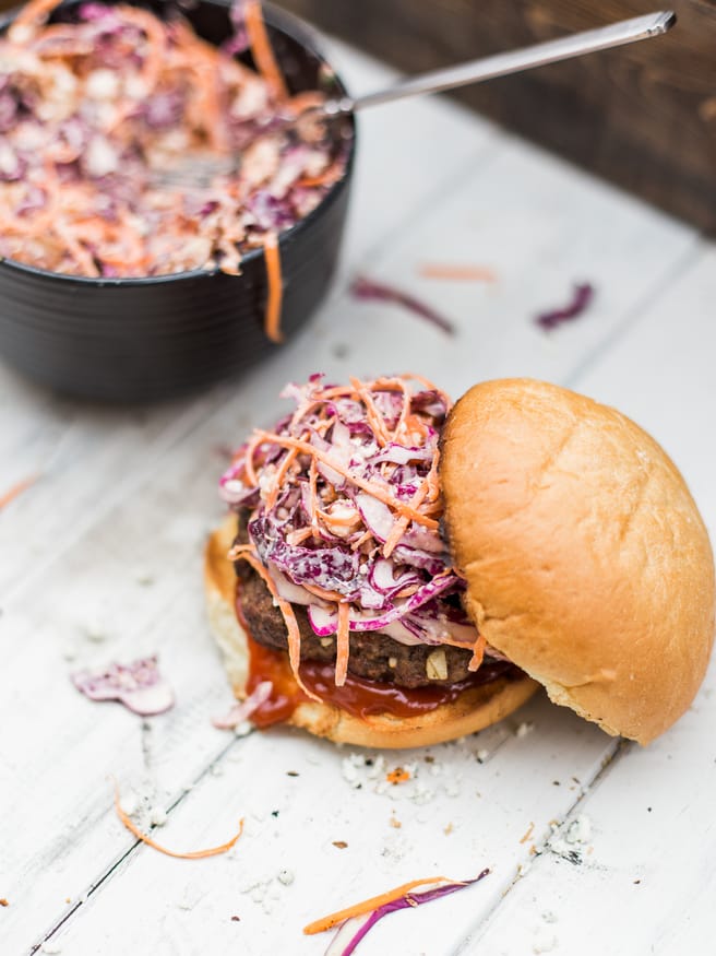 Bacon Bleu Cheese Cole Slaw Burger - A red cabage coleslaw topped on a half pound juicy burger. Amazing way to change up your burger night! dadwithapan.com