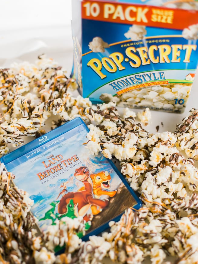 Zebra Popcorn recipe made a perfect companion for our Land Before Time Movie night! Drizzled with dark and white chocolate, caramel and chopped almonds!