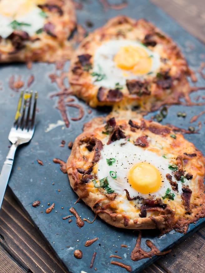 Breakfast pizza using Naan bread, loaded with cheese, bacon and topped with an egg! Hits the spot every morning!! 
