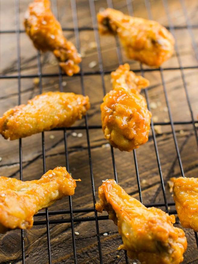 Honey Sriracha Beer Glaze - sounds amazing right? Put it over some crispy baked chicken wings and you have a match made in heaven!