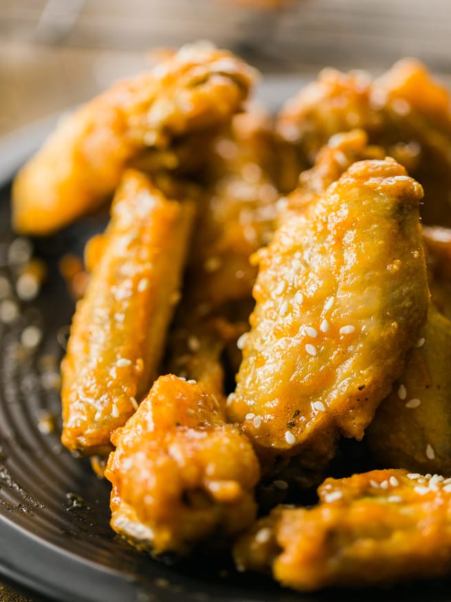 Honey Sriracha Beer Glaze - sounds amazing right? Put it over some crispy baked chicken wings and you have a match made in heaven!
