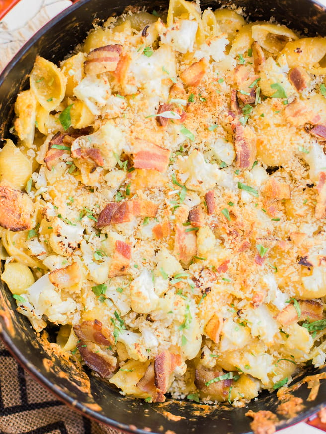 Homemade baked mac and cheese with roasted cauliflower and bacon mixed in. Loaded with cheddar and gruyere cheese, that's cheesy, smoky and full of flavor! 