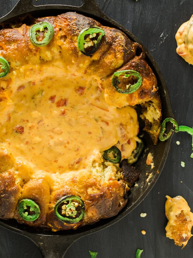 Turning your house into a Rotel Famous Queso house is ridiculously easy, with this pretzel ring skillet recipe making it the perfect one-pan dip!