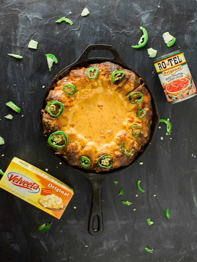 Turning your house into a Rotel Famous Queso house is ridiculously easy, with this pretzel ring skillet recipe making it the perfect one-pan dip!