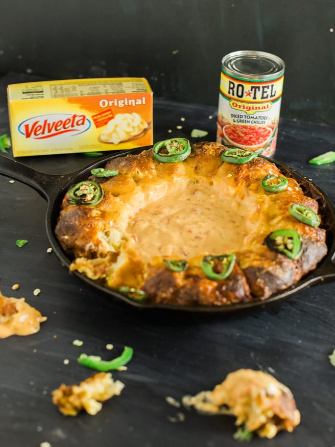 Turning your house into a Rotel Famous Queso house is ridiculously easy, with this pretzel ring skillet recipe making it the perfect one-pan dip!