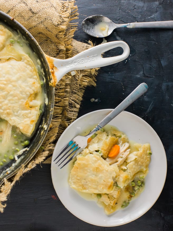 Chicken Pot Pie that's easy to prep. All in one skillet with pre-cooked rotisserie chicken, fresh rosemary, thyme peas and carrots! 