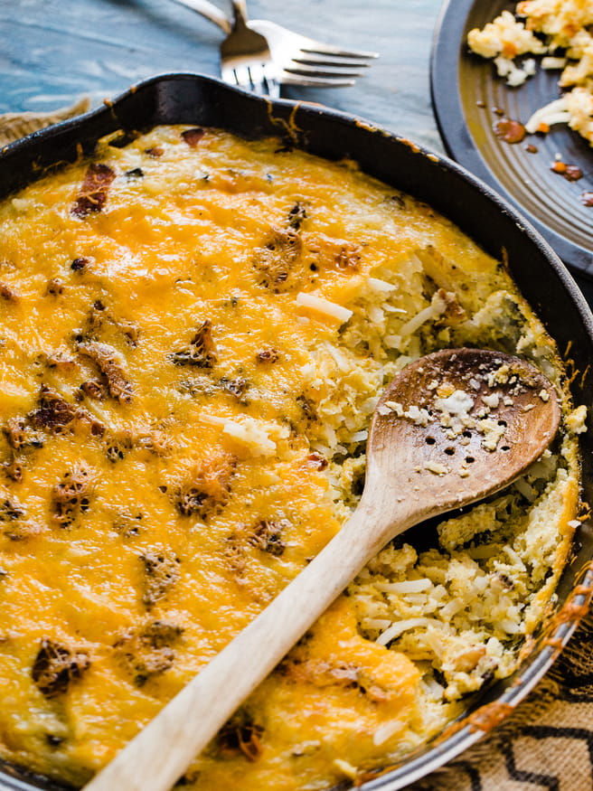 This breakfast skillet is loaded with cheese, bacon, and egg and hash browns. The ultimate casserole to bring to brunch!