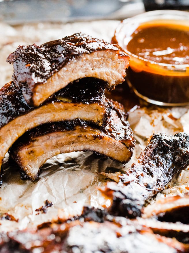 Slow grilled baby back ribs with a sweet and spicy barbecue rub. Grilled with a smoker box full of apple wood chips and super tender and delicious!