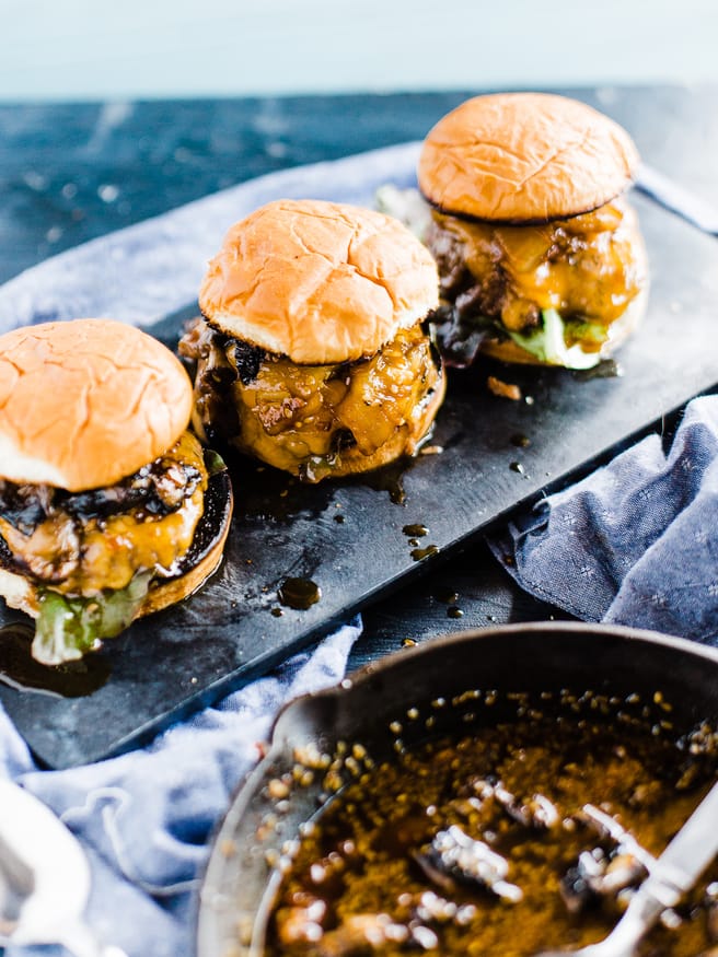 Teriyaki Burger topped with a Grilled pineapple, portabella mushroom, simmering in teriyaki sauce and topped on toasted Hawaiian hamburger rolls. 