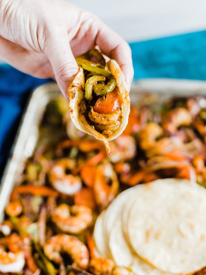 Spicy Shrimp fajitas with a homemade fajita seasoning. Cooked all on one sheet pan making this meal amazingly easy to prepare and cook!