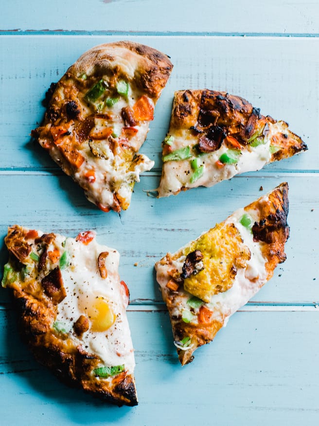 Breakfast Pizza meets Denver omelette. Topped with egg, bacon, bell peppers and cheese. A great way to start the weekend is with a breakfast pizza! 