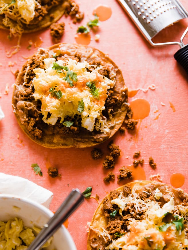 This Breakfast Tostada is loaded up with chorizo seasoned turkey, refried beans, scrambled eggs and cheese. The perfect way to start the day. SUPER EASY TO MAKE!