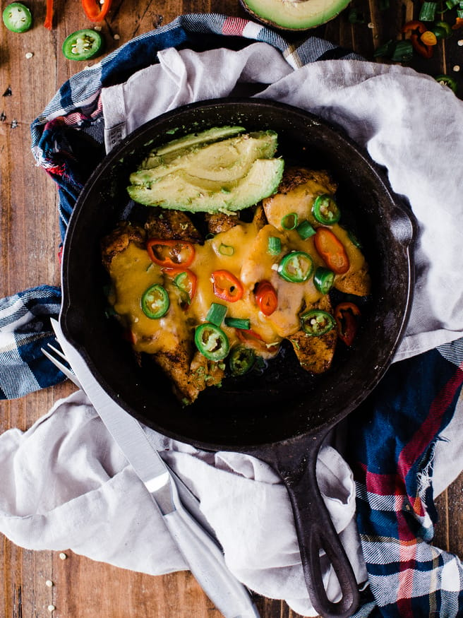 Spicy Skillet Chicken Tenders flambeed in tequila. Makes a great quick dinner, full of heat from fresno and serrano peppers and loaded with melted cheese on top! 