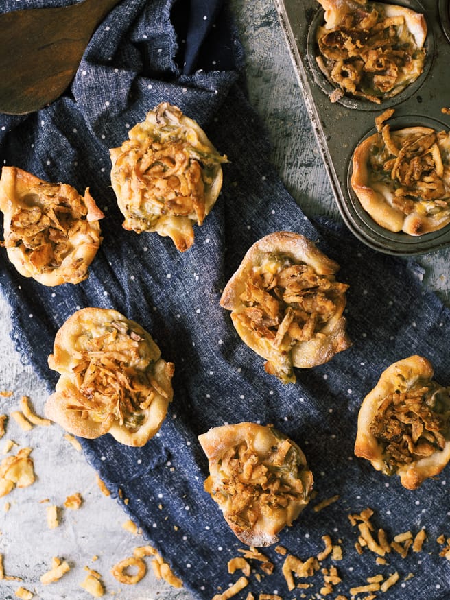 Green Bean Casserol Muffin Tin Cups are the perfect way to give green bean casserole new life. Perfect for Thanksgiving potlucks too!