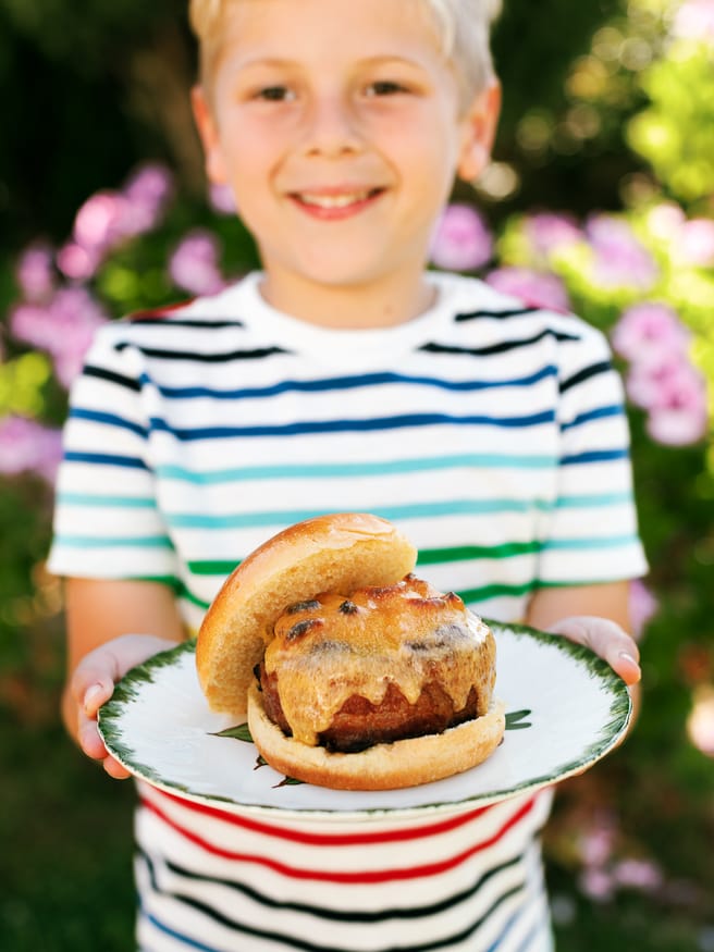 Bacon Wrapped Soda Can Burgers filled with Mac an Cheese for the kids, and grilled onion and mushroom with swiss for the adults!