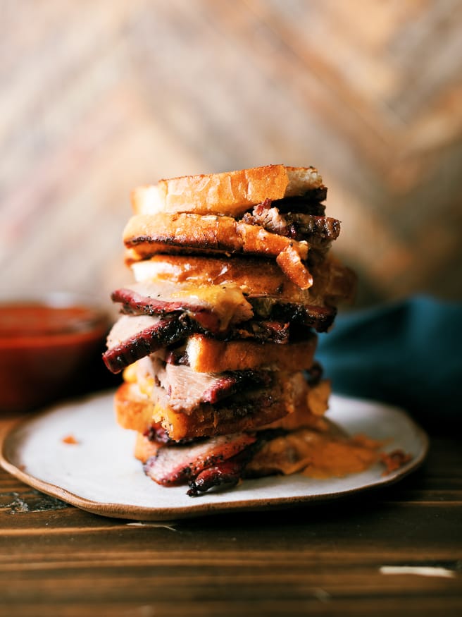 Smoky slices of brisket flat in between cheese and bread, to make a brisket grilled cheese sandwich that's a perfect use of leftover brisket!!