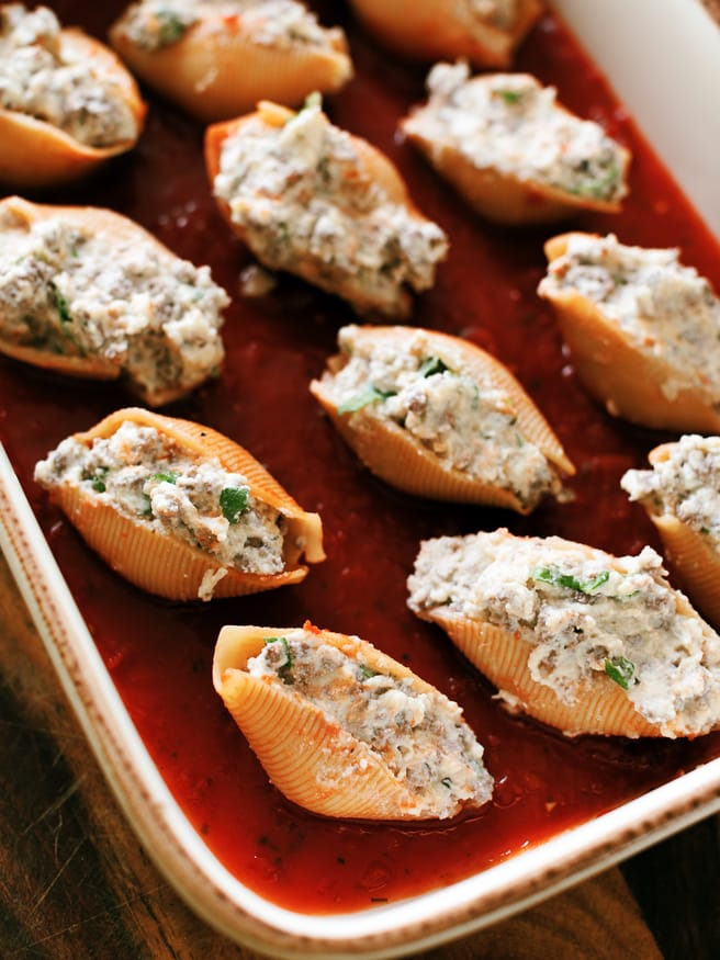 Lasagna stuffed shells with ground beef, ricotta and Italian seasonings, topped with mozzarella and can be made ahead of time!