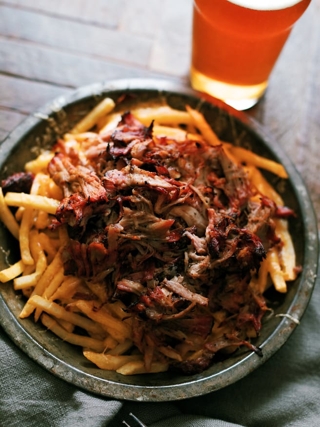 Leftover Smoked pulled pork gets a second life with this pulled pork cheese fries recipe. Its smokey, cheesy, and slathered with BBQ sauce on top of fries. What isn't there to like?!
