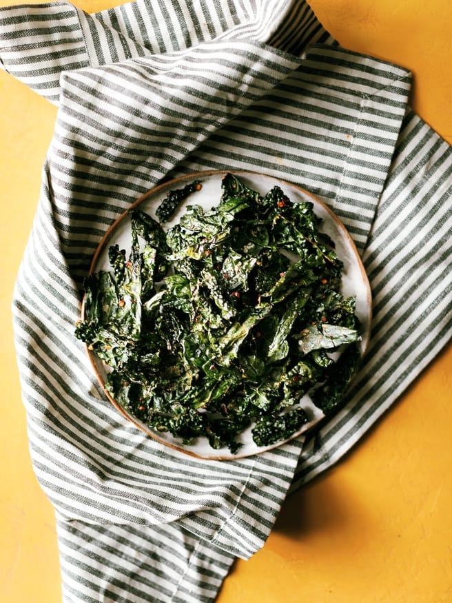 Kale Chips are so easy to make, and a great snack to munch on without the guilt. Easily one of my new favorite snacks on the go!