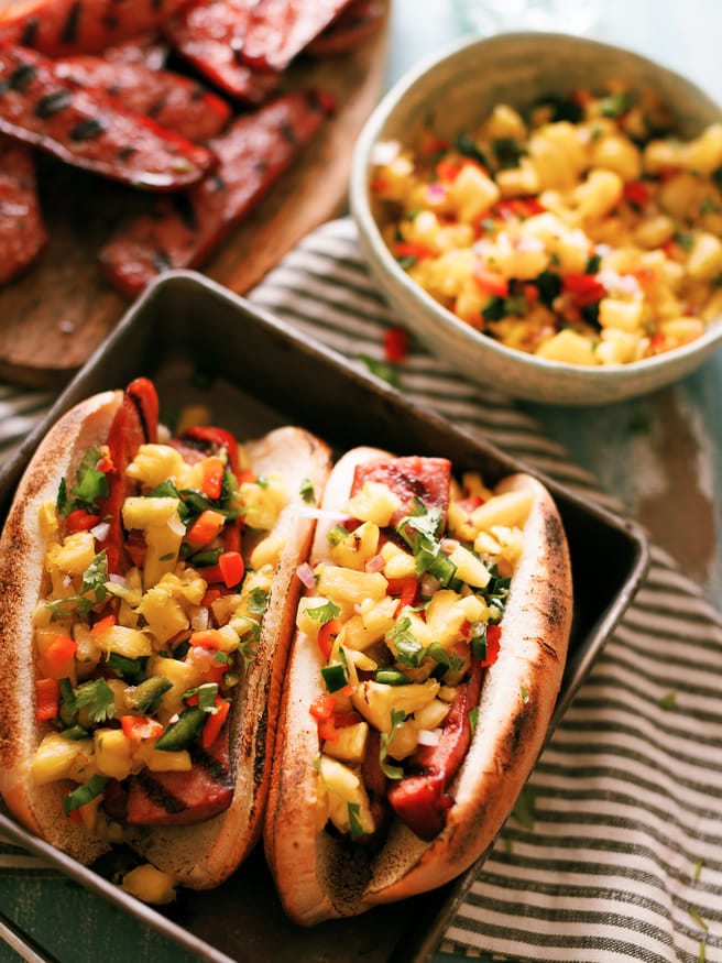 The smokiness from the sausage and bright, beautiful flavors from the pineapple
salsa go together perfectly in this awesome summer grilled sausage hoagie!
