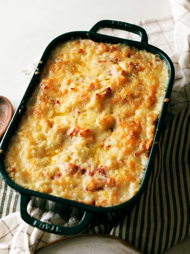 Use your leftover corned beef to make a Colcannon Corned Beef bake! Creamy mashed potatoes, tender cabbage, topped with aged cheddar.