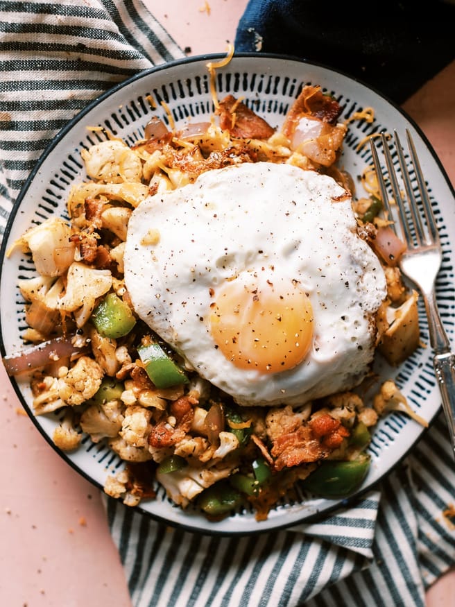 When you're craving skillet potatoes but can't, this cauliflower bacon hash recipe is just what you need to do the trick!