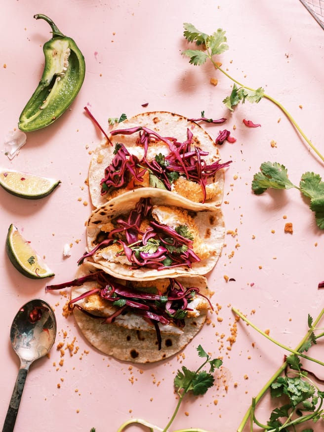 These tortilla chip crusted tilapia fish tacos with a jalapeno lime red cabbage slaw is exactly what you need in your life. 