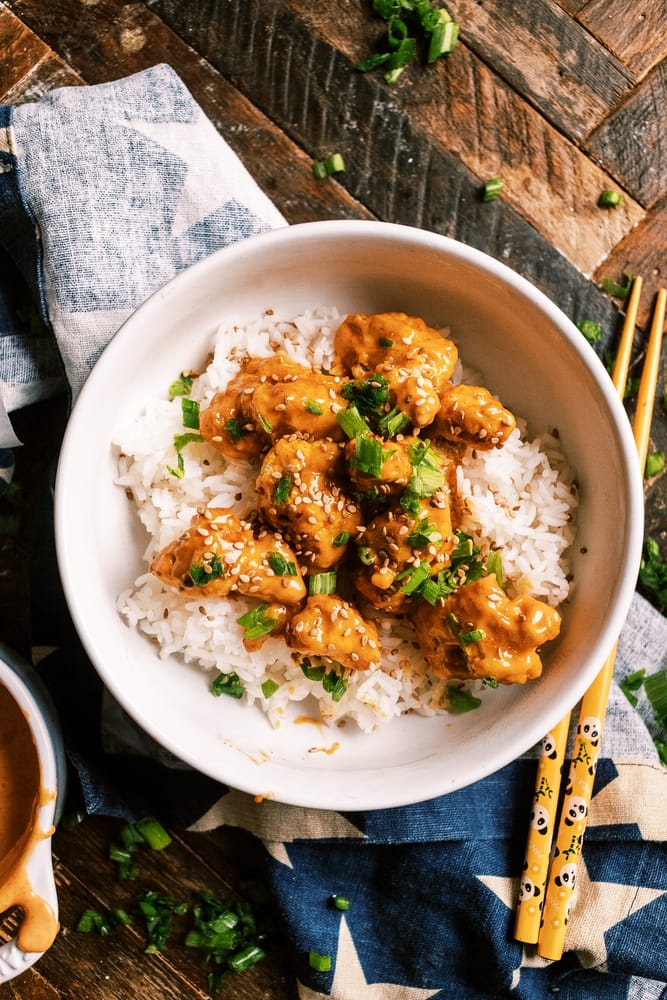 30-minute Air Fryer Bang Bang Chicken with crispy air-fried chicken bites, tossed in a spicy mayonnaise, sweet chili, and sriracha sauce