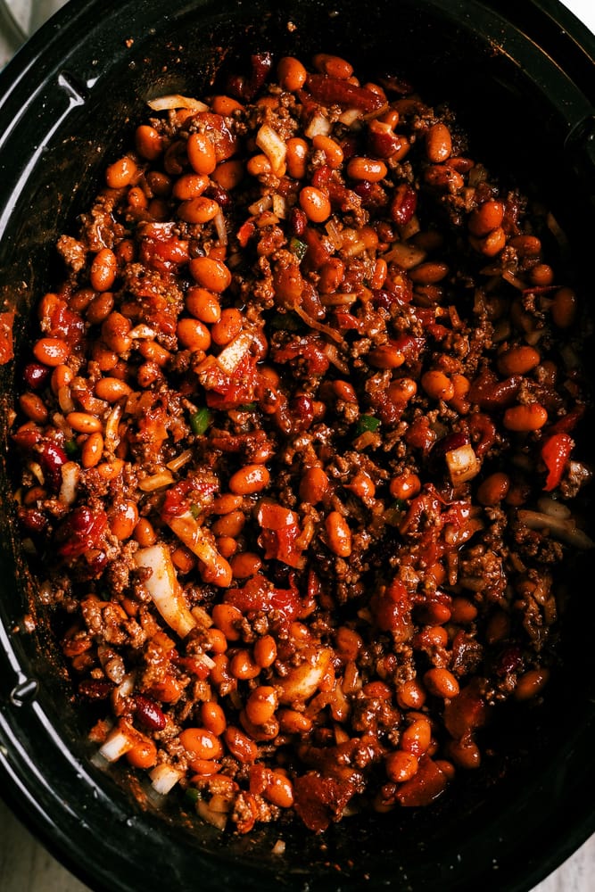 Spicy Slow Cooker chili that can be made in a crockpot or in the oven low and slow. Added heat from serrano and jalapeno peppers and yes - this chili had beans in it!