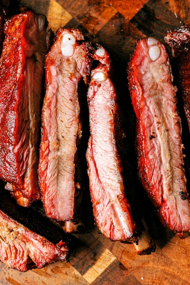 How to BBQ perfect tender and juicy St. louis Style Pork Ribs on the smoker every time. This is the best rib recipe you'll ever try!