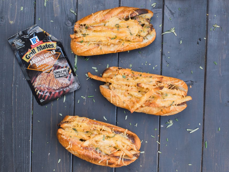 Grilled Steak and Cheese Fry Sandwich - This is got to be the best sandwich I've ever had using a Brown Sugar Bourbon Marinade, grilled new york strip, smothered cheese fries on a rosemary garlic buttered bun. YESS!