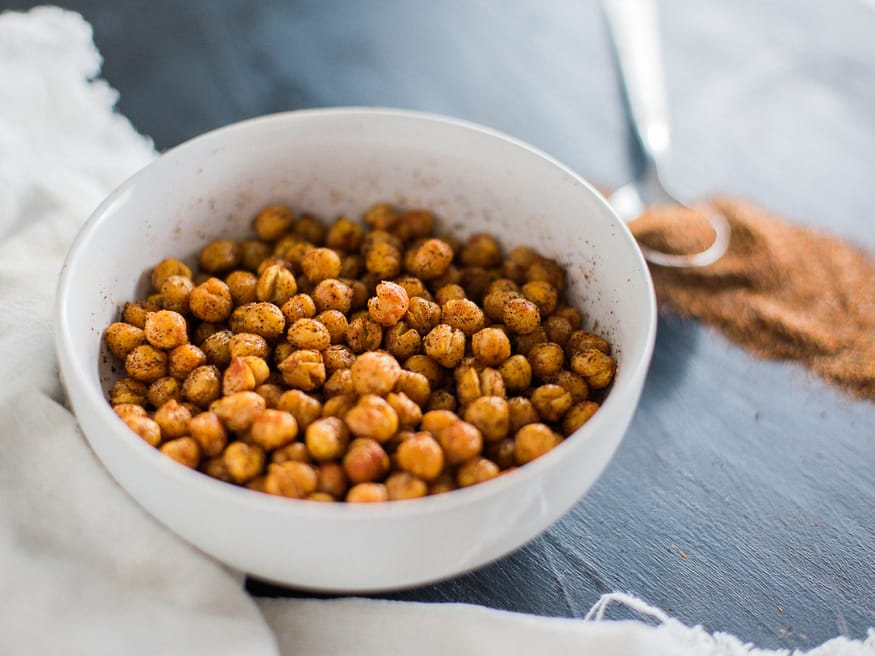 Roasted chickpeas with a from scratch chili seasoning. These roasted chickpeas taste amazing and are great to snack on when lounging around the house!