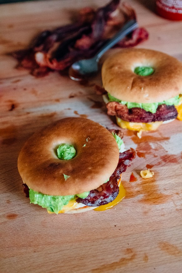 A breakfast bagel is the perfect way to start the morning! A beautifully runny egg with sriracha ketchup, guacamole, crisp bacon. 