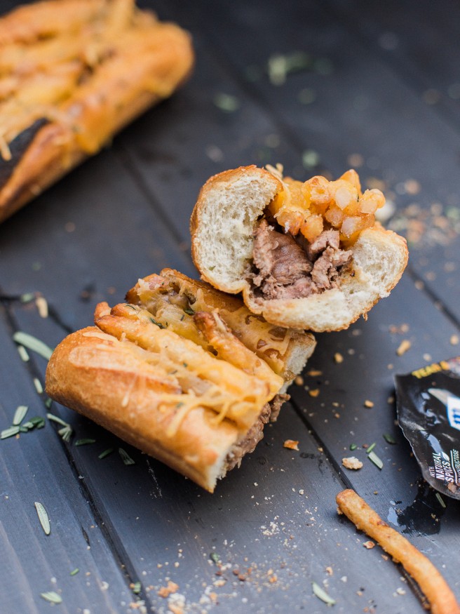 Grilled Steak and Cheese Fry Sandwich - This is got to be the best sandwich I've ever had using a Brown Sugar Bourbon Marinade, grilled new york strip, smothered cheese fries on a rosemary garlic buttered bun. YESS!