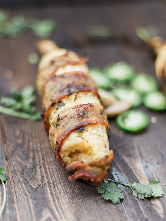 Bacon Wrapped Corn with a Jalapeno and Cilantro blend that will take your summer grilling to the next level! Full of flavor and spiciness! dadwithapan.com