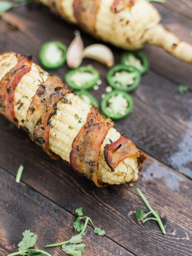 Bacon Wrapped Corn with a Jalapeno and Cilantro blend that will take your summer grilling to the next level! Full of flavor and spiciness! dadwithapan.com