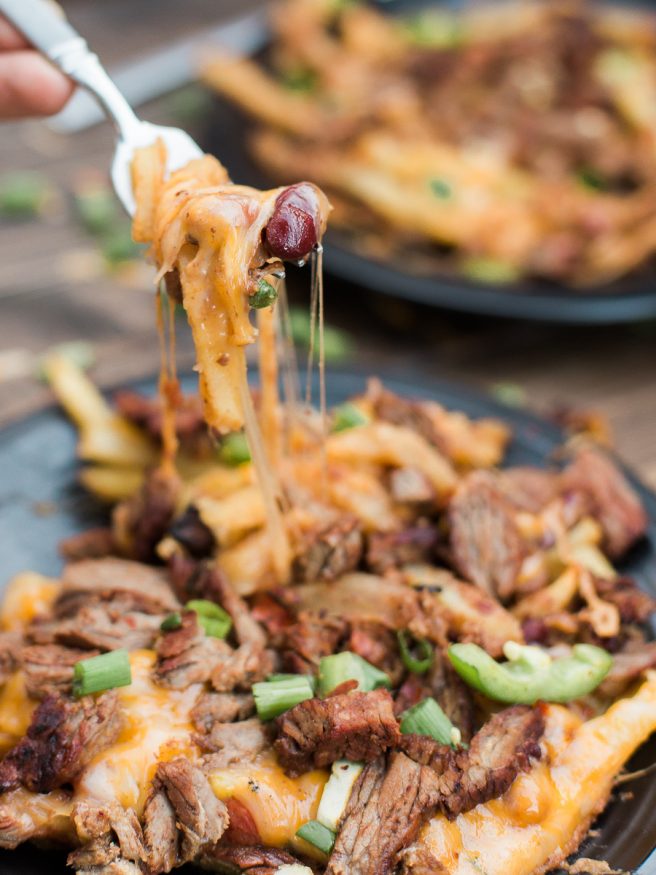 Carne Asada Fries with Chili and cheese! The best combination in the world and it's going to be a crowd pleaser. Perfect for entertaining!