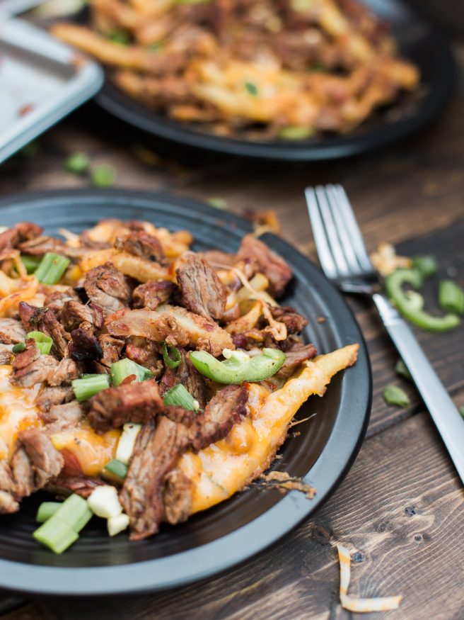 Carne Asada Fries with Chili and cheese! The best combination in the world and it's going to be a crowd pleaser. Perfect for entertaining!