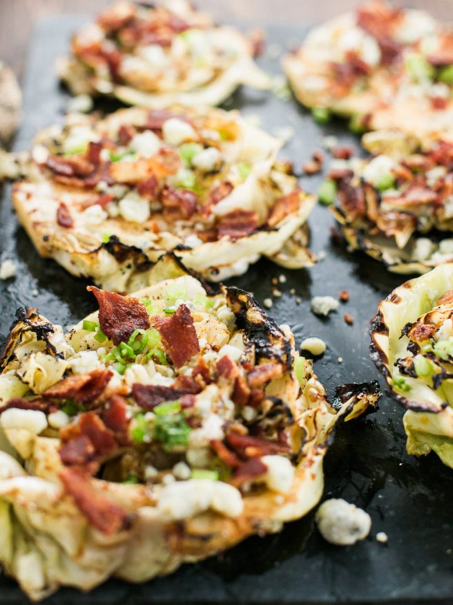 Grilled Cabbage Steaks Marinated With McCormick Grill Mates Smoky Applewood seasoning, topped with Bacon, Blue Cheese, and Green onions!