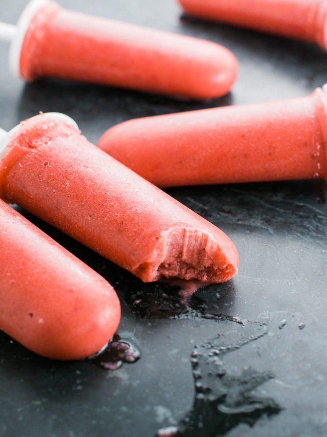 Popsicles with banana ice cream, strawberries, and coconut almond milk. Guiltless and perfect for a hot summer day! 