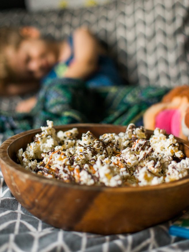 Zebra Popcorn recipe made a perfect companion for our Land Before Time Movie night! Drizzled with dark and white chocolate, caramel and chopped almonds!