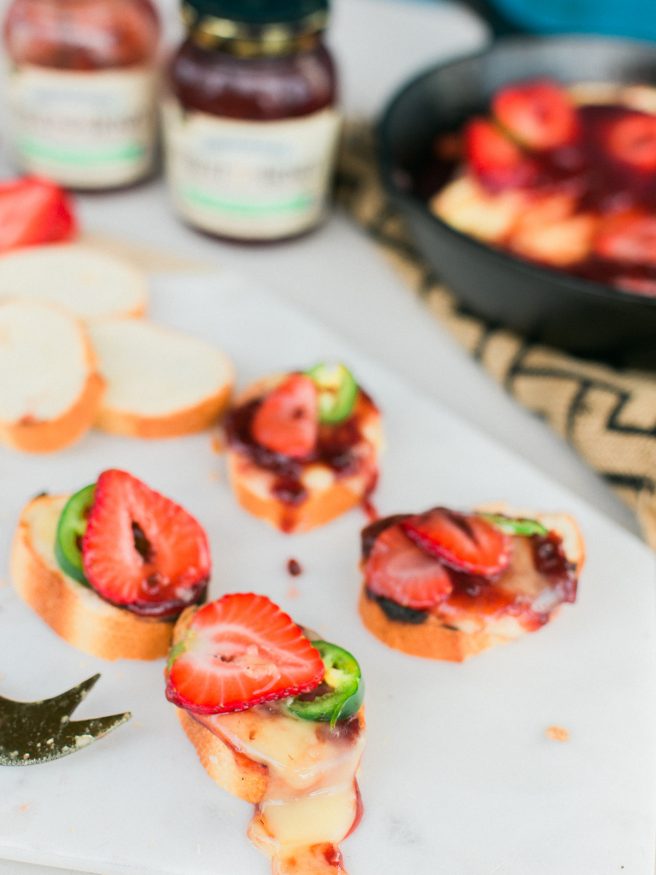Grilled brie that will make you a hero at home. Grilled with Strawberry and Jalapeno spread makes for a sweet savory and spicy appetizer everyone will love! 