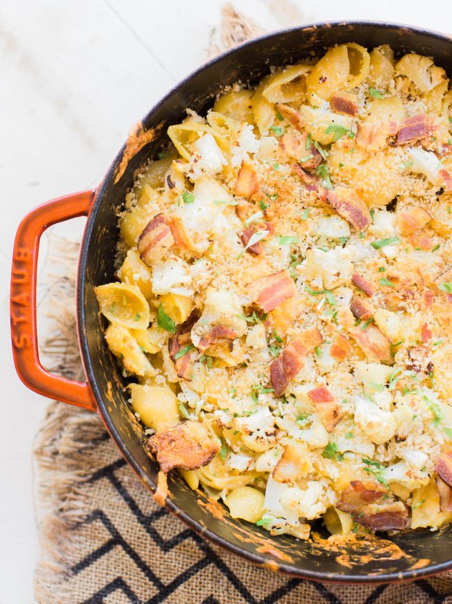 Homemade baked mac and cheese with roasted cauliflower and bacon mixed in. Loaded with cheddar and gruyere cheese, that's cheesy, smoky and full of flavor! 