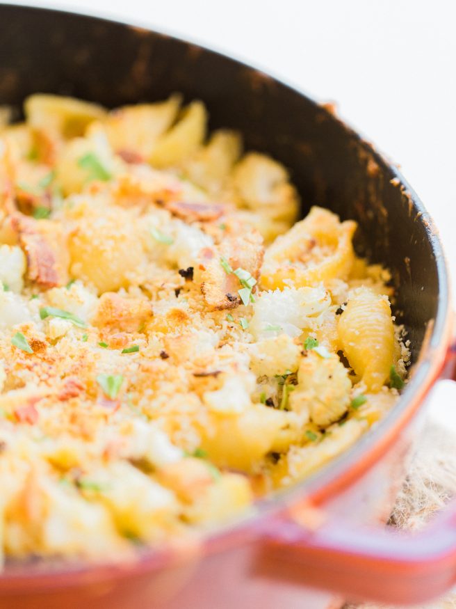 Homemade baked mac and cheese with roasted cauliflower and bacon mixed in. Loaded with cheddar and gruyere cheese, that's cheesy, smoky and full of flavor! 