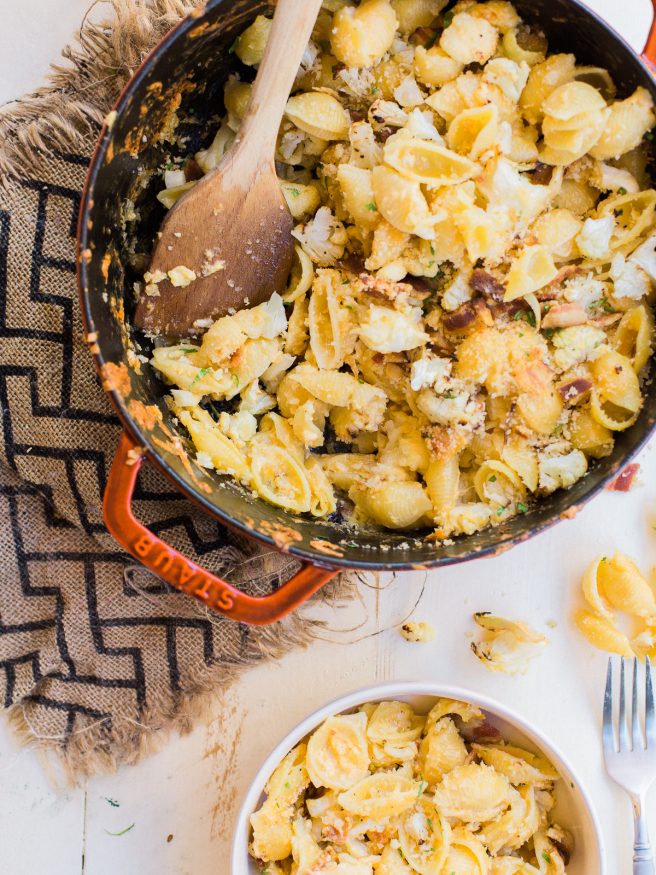 Homemade baked mac and cheese with roasted cauliflower and bacon mixed in. Loaded with cheddar and gruyere cheese, that's cheesy, smoky and full of flavor! 