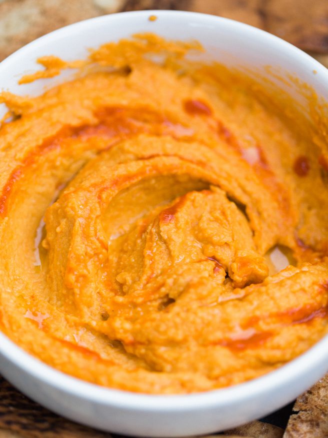 This sriracha hummus can be made in under 10 minutes, has bold flavor and nice heat that you'll want to put on everything!